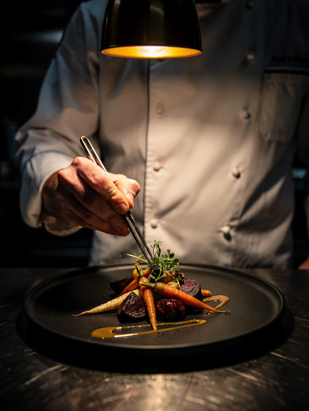 Nina, junior chef, carefully prepping seasonal vegetables for service